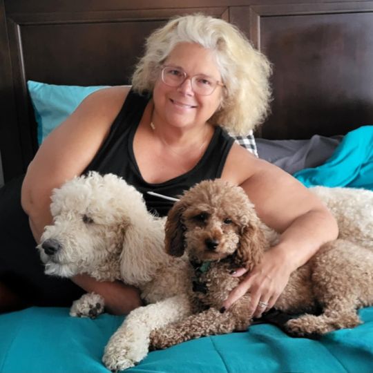 Paw Patrol Dayton's September 2024 Volunteer of the month, Dara Hardyman with her two dogs